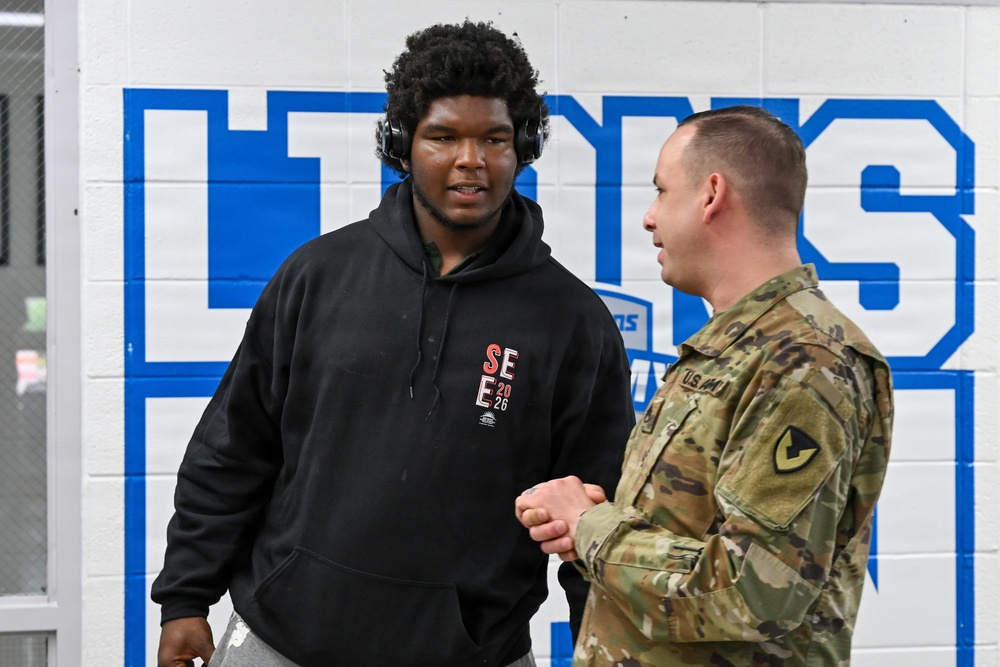 U.S. Army Tank-automotive and Armaments Command and Detroit Arsenal Soldiers join Detroit Lions Academy students to pack care kits for deployed Soldiers