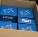U.S. Army Tank-automotive and Armaments Command and Detroit Arsenal Soldiers join Detroit Lions Academy students to pack care kits for deployed Soldiers