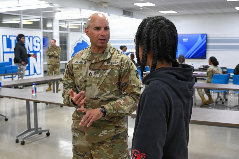 U.S. Army Tank-automotive and Armaments Command and Detroit Arsenal Soldiers join Detroit Lions Academy students to pack care kits for deployed Soldiers