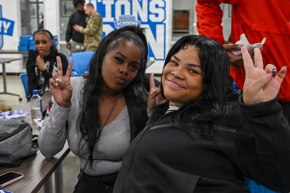 U.S. Army Tank-automotive and Armaments Command and Detroit Arsenal Soldiers join Detroit Lions Academy students to pack care kits for deployed Soldiers