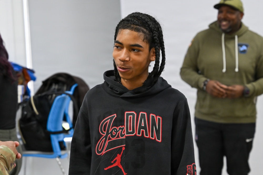 U.S. Army Tank-automotive and Armaments Command and Detroit Arsenal Soldiers join Detroit Lions Academy students to pack care kits for deployed Soldiers