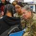 U.S. Army Tank-automotive and Armaments Command and Detroit Arsenal Soldiers join Detroit Lions Academy students to pack care kits for deployed Soldiers