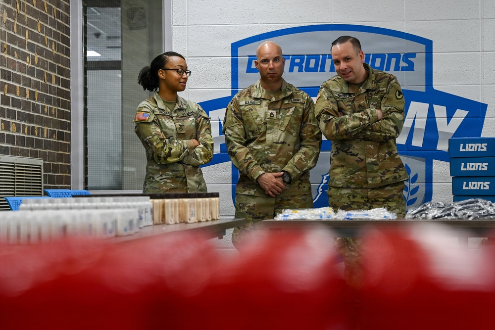 U.S. Army Tank-automotive and Armaments Command and Detroit Arsenal Soldiers join Detroit Lions Academy students to pack care kits for deployed Soldiers