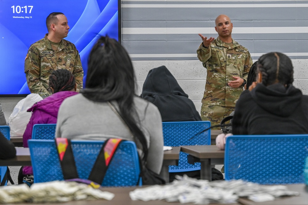 U.S. Army Tank-automotive and Armaments Command and Detroit Arsenal Soldiers join Detroit Lions Academy students to pack care kits for deployed Soldiers