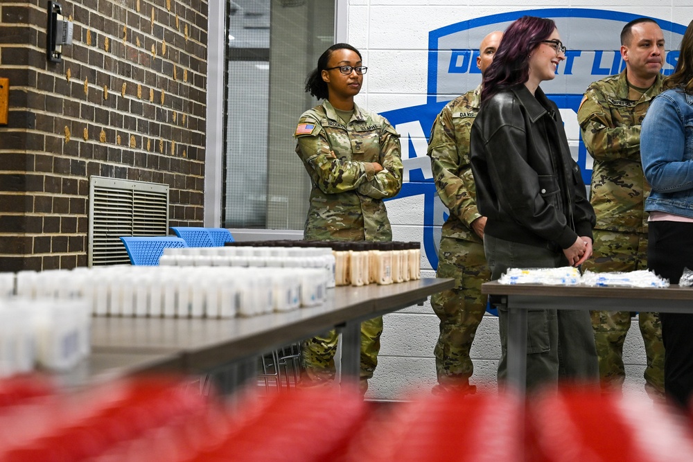 U.S. Army Tank-automotive and Armaments Command and Detroit Arsenal Soldiers join Detroit Lions Academy students to pack care kits for deployed Soldiers