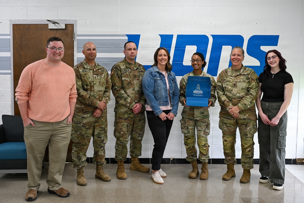 U.S. Army Tank-automotive and Armaments Command and Detroit Arsenal Soldiers join Detroit Lions Academy students to pack care kits for deployed Soldiers