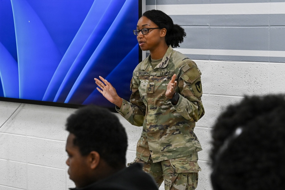 U.S. Army Tank-automotive and Armaments Command and Detroit Arsenal Soldiers join Detroit Lions Academy students to pack care kits for deployed Soldiers