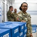 U.S. Army Tank-automotive and Armaments Command and Detroit Arsenal Soldiers join Detroit Lions Academy students to pack care kits for deployed Soldiers