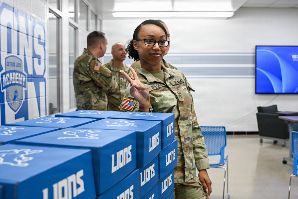 U.S. Army Tank-automotive and Armaments Command and Detroit Arsenal Soldiers join Detroit Lions Academy students to pack care kits for deployed Soldiers