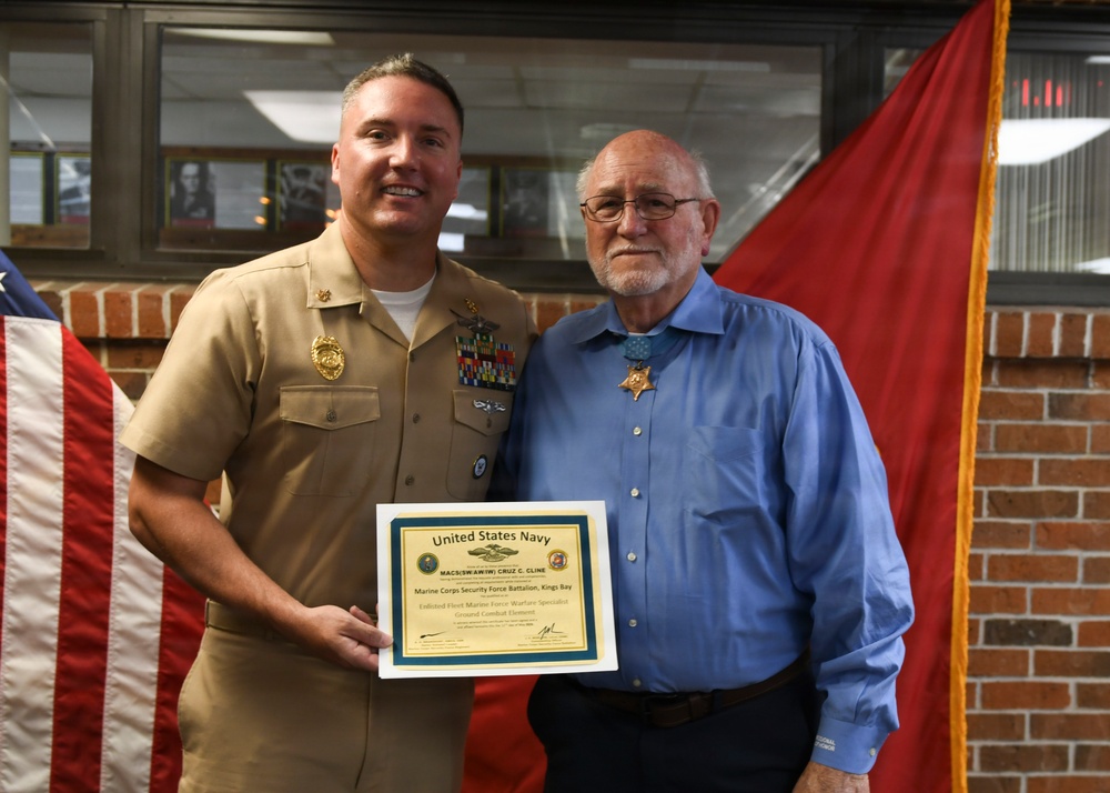 Medal of Honor Recipient pins FMF Warfare Device on MCSFBn Senior Chief