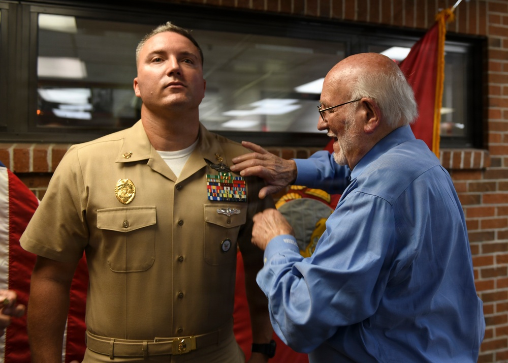 Medal of Honor Recipient pins FMF Warfare Device on MCSFBn Senior Chief