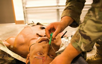 A Soldier with the 184th Expeditionary Sustainment Command, MSARNG, conducts Combat Life Saver (CLS) Training during Annual Training