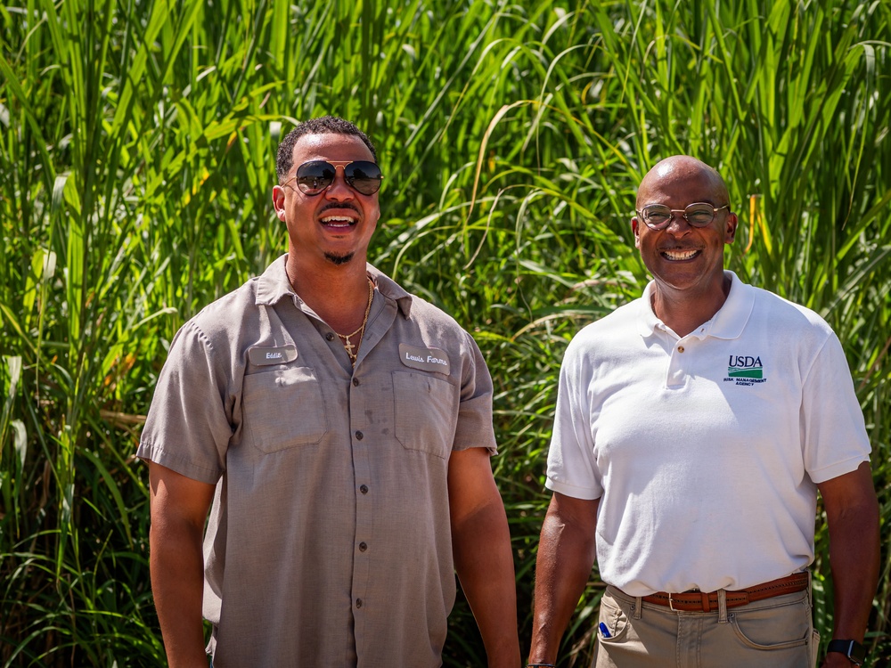 Sugarcane farmer with RMA employee