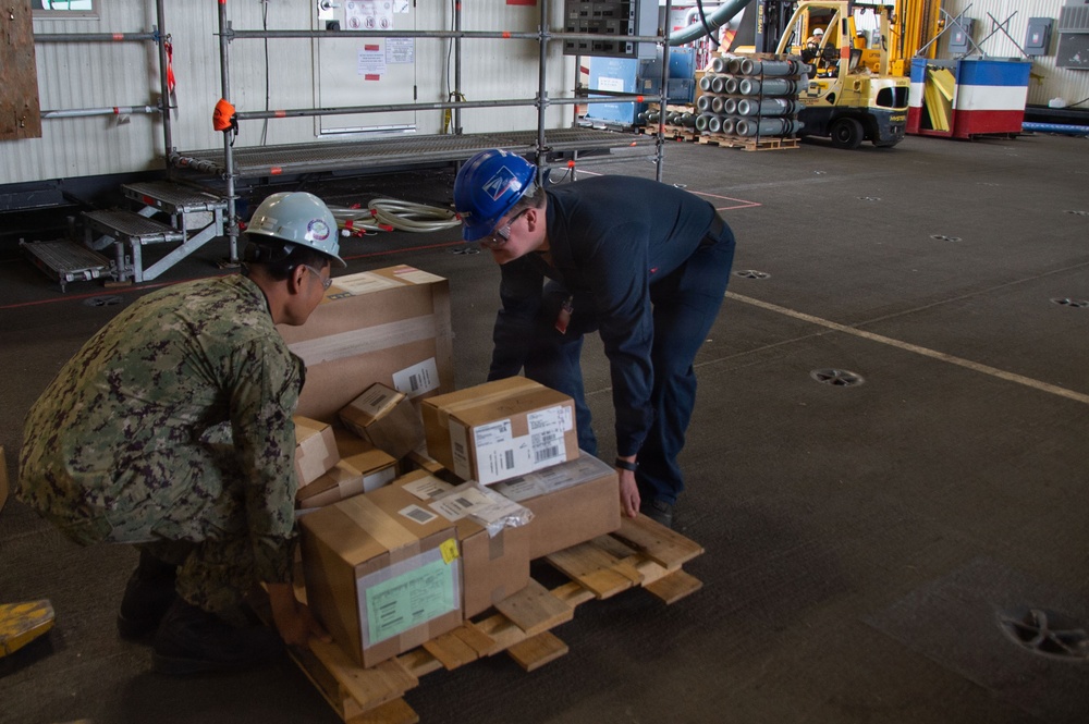 USS Ronald Reagan (CVN 76) Sailors Transport Supplies