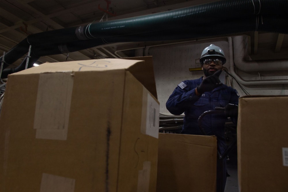 USS Ronald Reagan (CVN 76) Sailors Transport Supplies