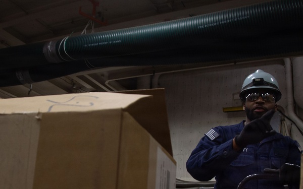 USS Ronald Reagan (CVN 76) Sailors Transport Supplies