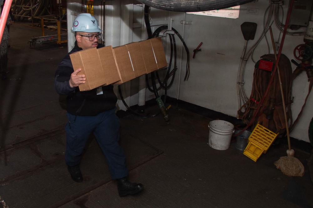 USS Ronald Reagan (CVN 76) Sailors Transport Supplies