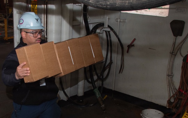 USS Ronald Reagan (CVN 76) Sailors Transport Supplies