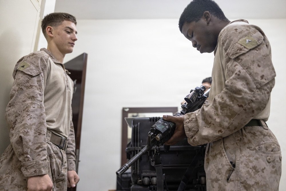 U.S. Marines clean and inspect M4 carbines