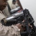 U.S. Marines clean and inspect M4 carbines