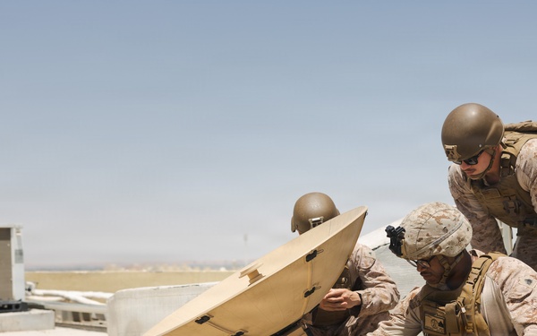 U.S. Marines perform operations check on Tampa Microwave Satellite