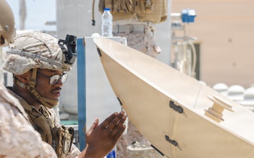 U.S. Marines perform operations check on Tampa Microwave Satellite