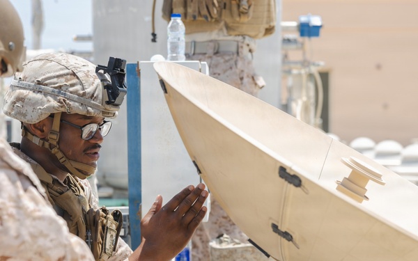U.S. Marines perform operations check on Tampa Microwave Satellite