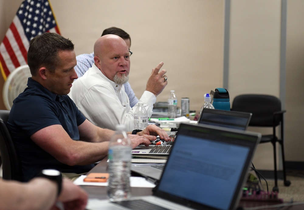 Newman speaks during training