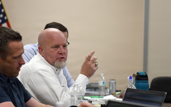 Newman speaks during training
