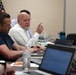 Newman speaks during training