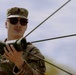 U.S. Army Soldier with the 335th Signal Command Sets Up Antennas in Preparation for the Best Squad Competition