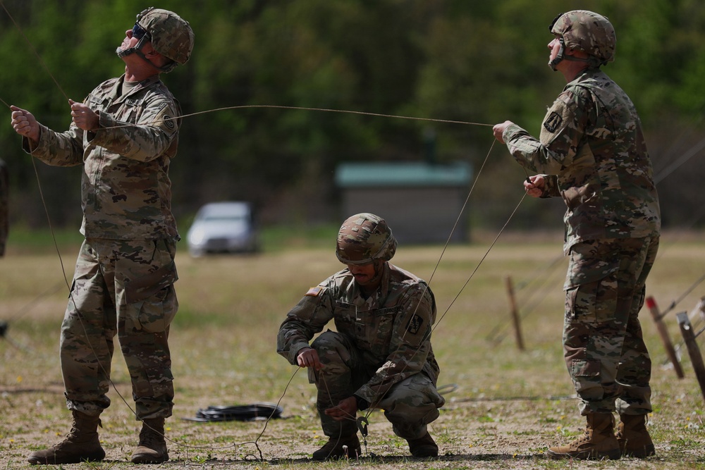 U.S. Army Soldiers with the 335th Signal Command Set Up Antennas for the Best Squad Competition