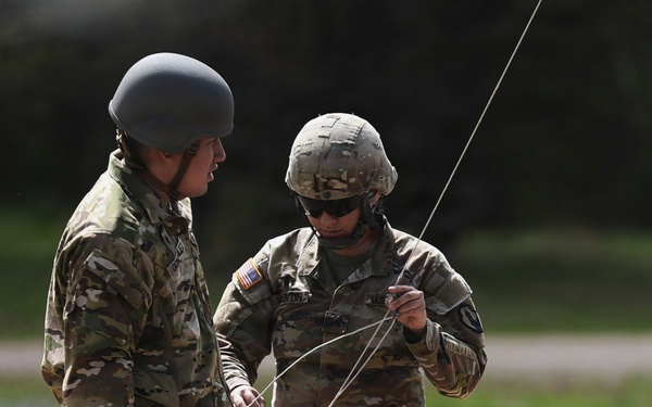 U.S. Army Soldiers with the 335th Signal Command Set Up Antennas in Preparation for the Best Squad Competition
