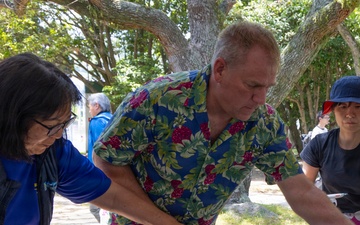 Deputy Public Works Officer David Frankranzen serves cake during a picnic