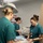 Military medical professionals operate without power