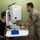 Military medical professionals operate without power