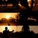 Service members conduct physical training exercises at sunset during early morning PT session