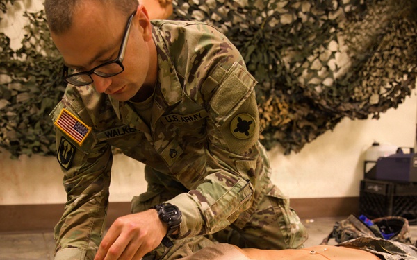 A Soldier with the 184th Expeditionary Sustainment Command, MSARNG, conducts Combat Life Saver (CLS) Training during Annual Training
