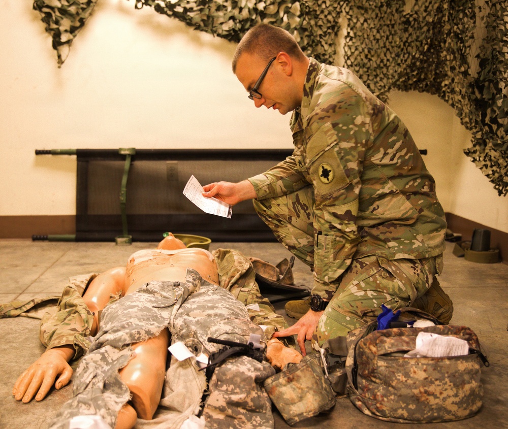 A Soldier with the 184th Expeditionary Sustainment Command, MSARNG, conducts Combat Life Saver (CLS) Training during Annual Training