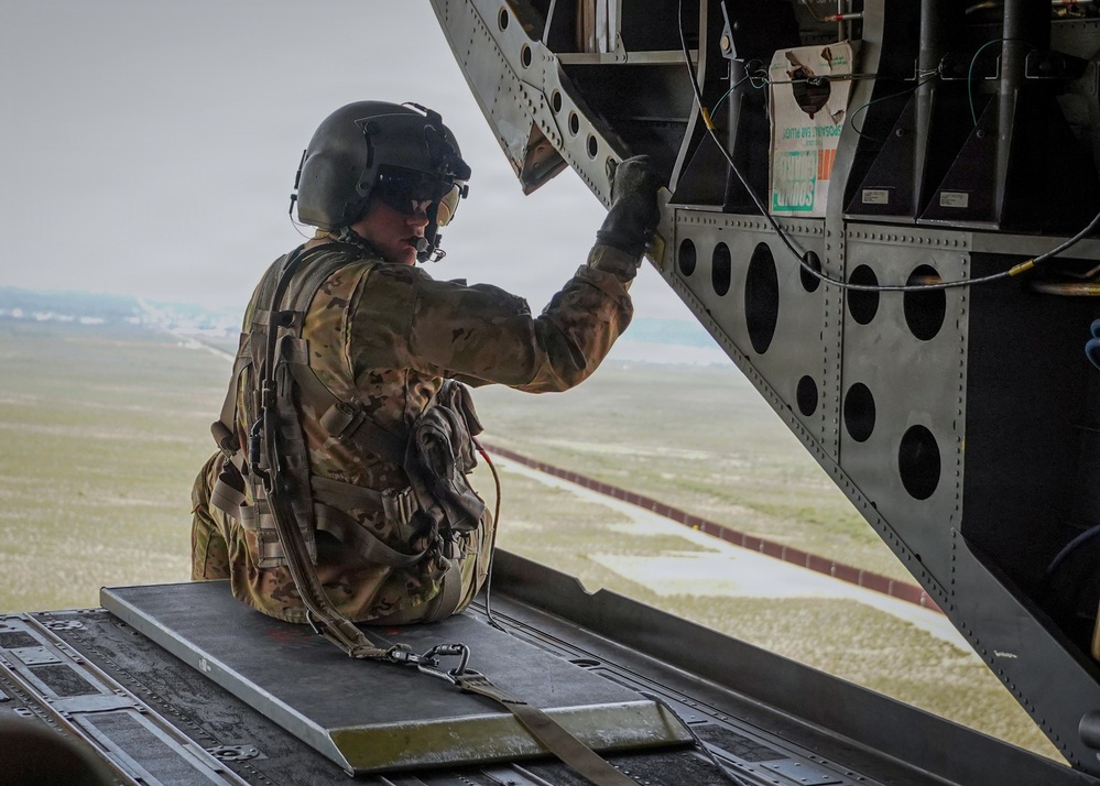 CH-47 aircrew member observes southern border wall during flight