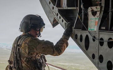 CH-47 aircrew member observes southern border wall during flight