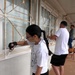 Team Souda paints a local elementary school during a community outreach event