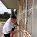 Team Souda paints a local elementary school during a community outreach event