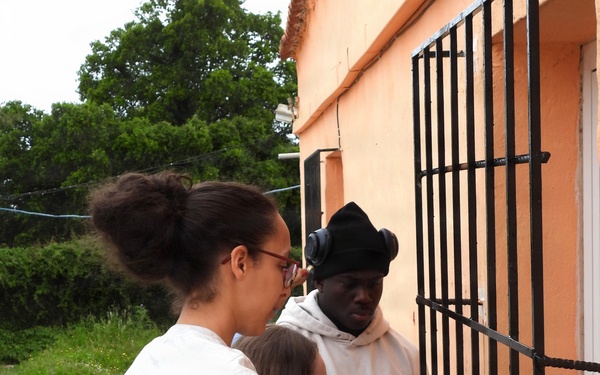 Team Souda paints a local elementary school during a community outreach event