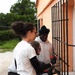 Team Souda paints a local elementary school during a community outreach event