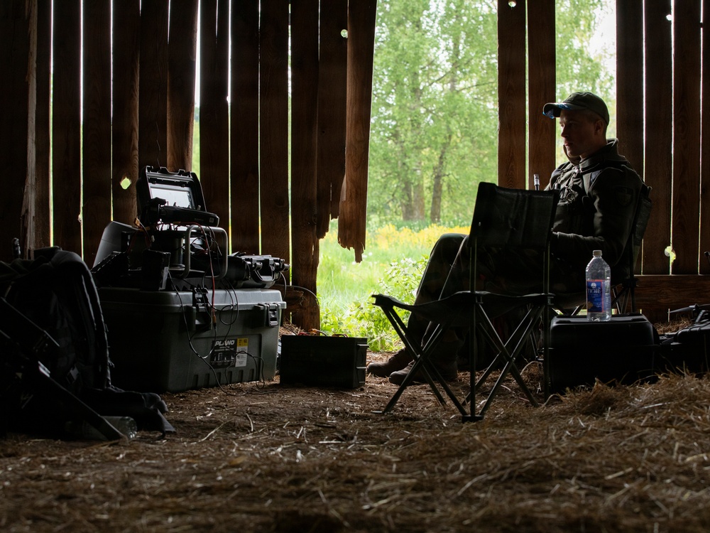 Lithuanian Armed Forces Member Guards Drone Controls