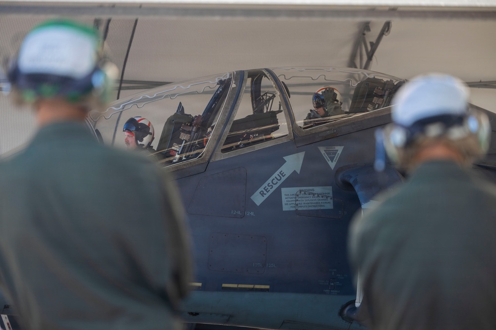 U.S. Marines with VMA-223 fly in a TAV-8B Harrier II