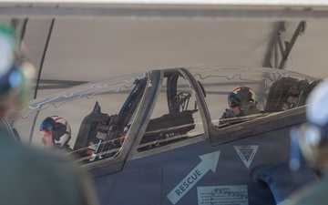 U.S. Marines with VMA-223 fly in a TAV-8B Harrier II
