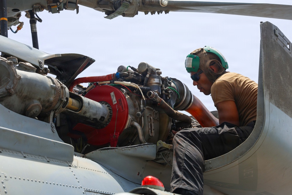 John Finn Sailors conduct pre-flight maintenance
