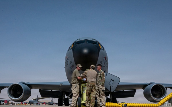 KC-135 Stratotanker refuels F-16 Fighting Falcon during security operations